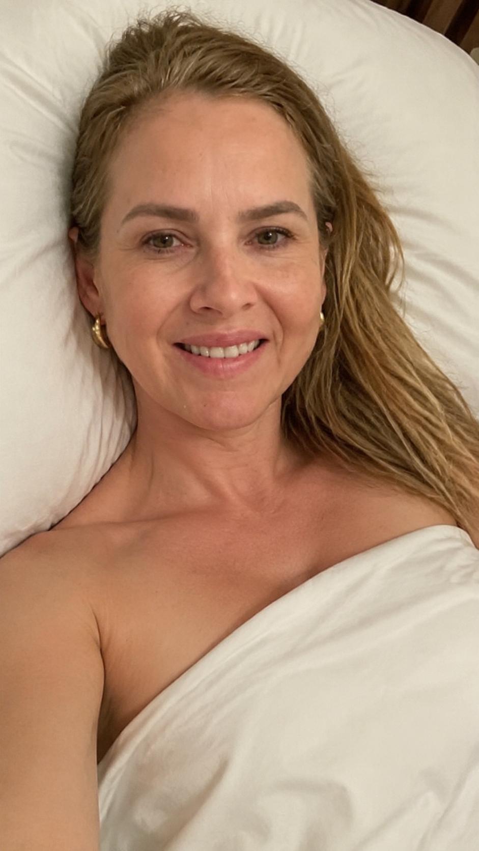 Woman Resting Peacefully in Bed